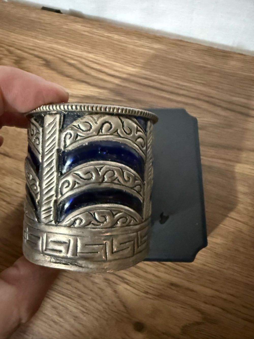 Metal and glass votive candle holder